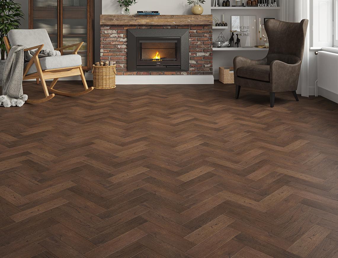 Luxury dark oak herringbone engineered wood flooring in a traditional living room with a brick fireplace.