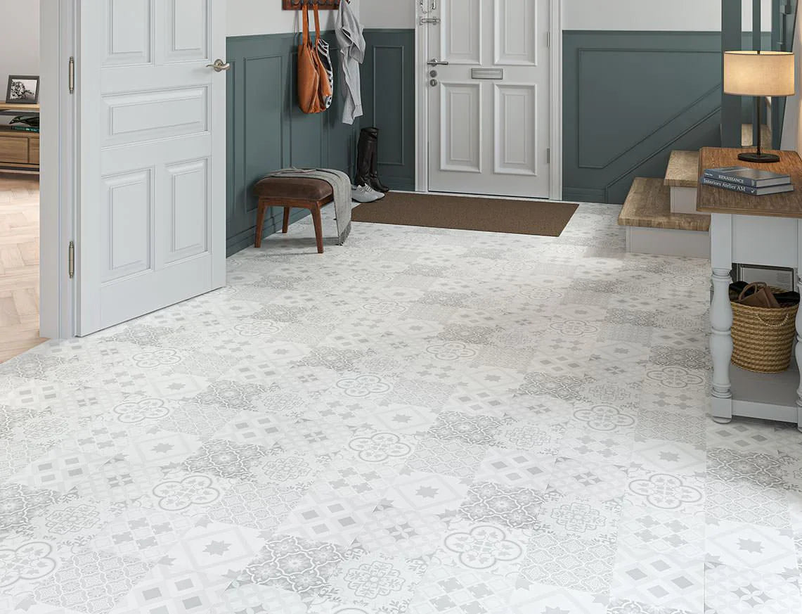 Modern hallway featuring light grey patterned laminate flooring with white doors and traditional decor.